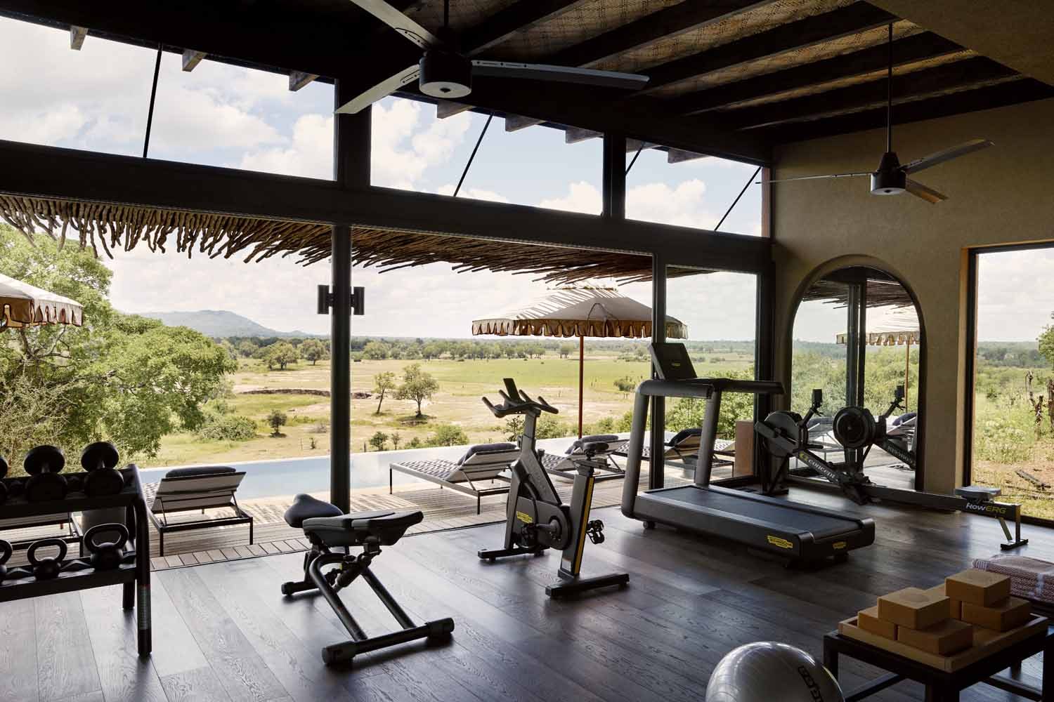 The gym at Chichele, open to the valley beside the rim-flow pool