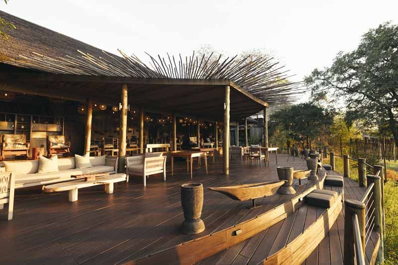 Riverside daybeds on the Lolebezi deck at sunset