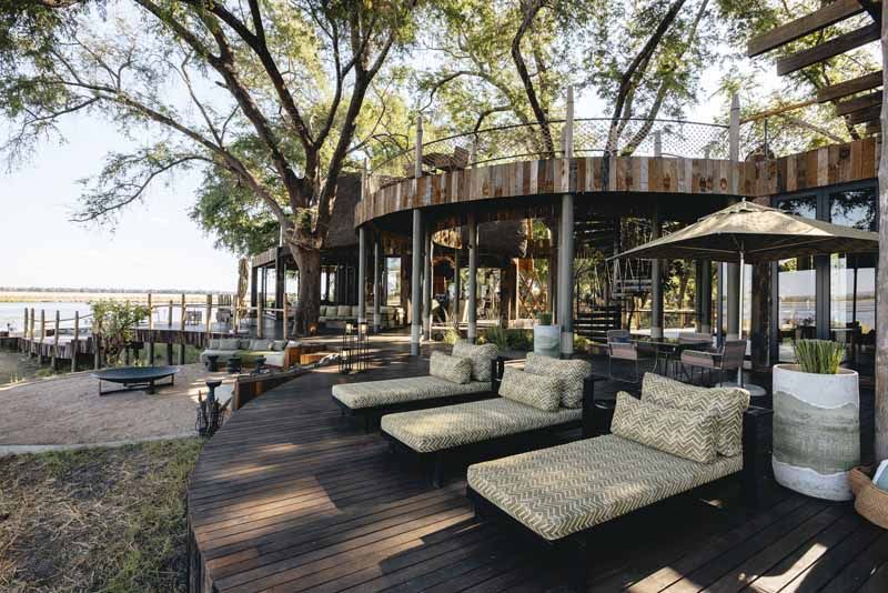 Shaded deck seating under the trees at Lolebezi