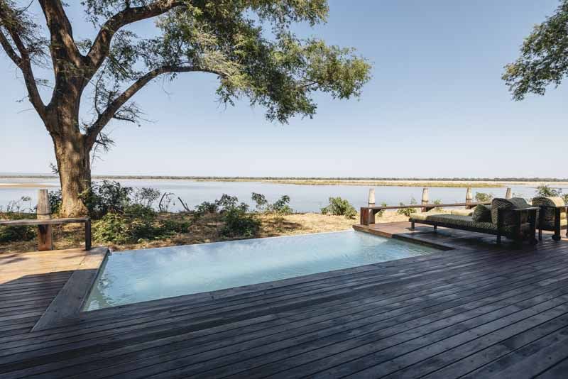 The Lolebezi infinity pool reaching out over the Zambezi floodplain