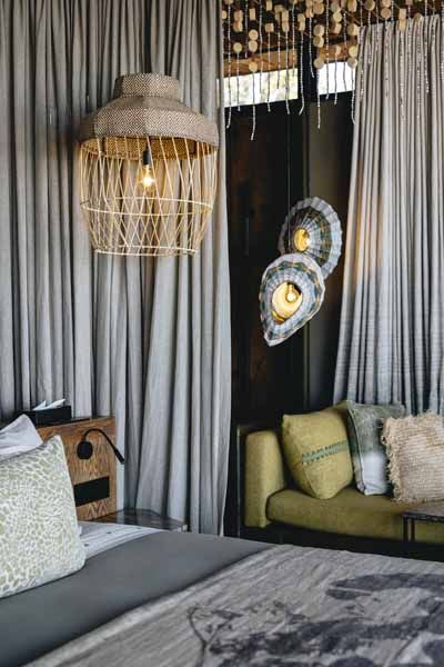 Interior of a Lolebezi superior suite with woven pendant lighting