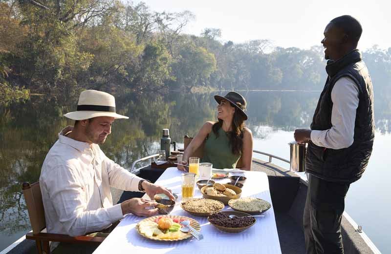 Breakfast served on the water on the Lunga River