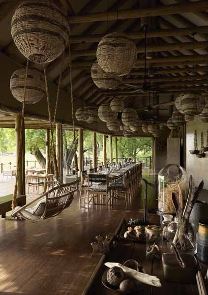 Lantern-lit lounge under thatch at Puku Ridge