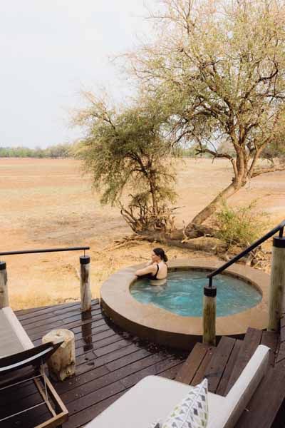 Private plunge pool beneath a marula tree at Puku Ridge