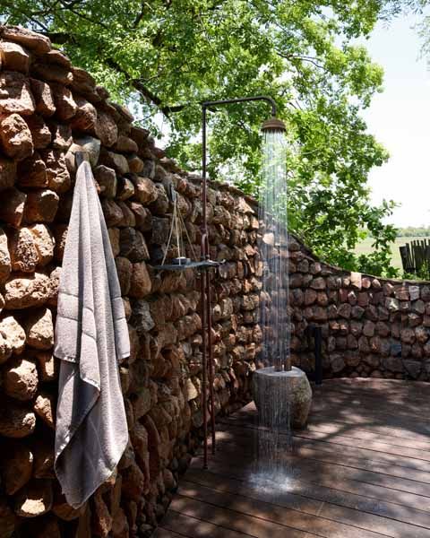 Outdoor shower at a Puku Ridge suite